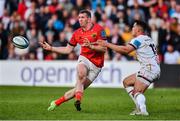 3 June 2022; Chris Farrell of Munster offloads despite the tackle of James Hume of Ulster during the United Rugby Championship Quarter-Final match between Ulster and Munster at Kingspan Stadium in Belfast. Photo by Ben McShane/Sportsfile