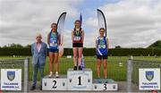 4 June 2022; President of the Irish Schools Athletic Association Billy Delaney, with junior girls 1200m walk medallists, from left, Savanagh O'Callaghan of Mercy Tuam, Galway, silver, India Cunniffe of Presentation Tuam, Galway, gold, and Lily Ryan of Our Lady of Lourdes New Ross, Wexford, bronze, at the Irish Life Health All Ireland Schools Track and Field Championships at Tullamore in Offaly. Photo by Sam Barnes/Sportsfile