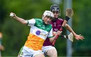 4 June 2022; Niall Flannery of Offaly in action against Seán Brennan of Westmeath during the Electric Ireland Challenge Corn Jerome O'Leary Final match between Westmeath and Offaly Lilywhites at the National Games Development Centre in Abbotstown, Dublin. Photo by Ben McShane/Sportsfile