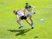 4 June 2022; Cian Donohoe of Offaly in action against Adrian Varley of New York during the Tailteann Cup Quarter-Final match between Offaly and New York at O'Connor Park in Tullamore, Offaly. Photo by David Fitzgerald/Sportsfile