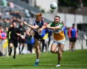 4 June 2022; Adrian Varley of New York in action against Anton Sullivan of Offaly during the Tailteann Cup Quarter-Final match between Offaly and New York at O'Connor Park in Tullamore, Offaly. Photo by David Fitzgerald/Sportsfile