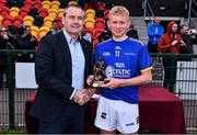 4 June 2022; Robbie Ryan of Tipperary is presented the Best & Fairest player of the match by Ulster GAA President Ciarán McLaughlin after the Electric Ireland Challenge Corn Michael Hogan Final match between Galway and Tipperary at the National Games Development Centre in Abbotstown, Dublin. Photo by Ben McShane/Sportsfile