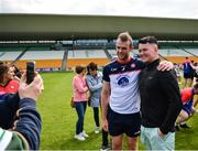 4 June 2022; Jonathan Glynn of New York poses for a photo with a supporter after the Tailteann Cup Quarter-Final match between Offaly and New York at O'Connor Park in Tullamore, Offaly. Photo by David Fitzgerald/Sportsfile