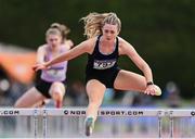 4 June 2022; Lucy McGlynn of Colaiste Cholmcille Ballyshannon, Donegal, on her way to winning the senior girls 100m hurdles at the Irish Life Health All Ireland Schools Track and Field Championships at Tullamore in Offaly. Photo by Sam Barnes/Sportsfile