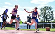 4 June 2022; Katie Doherty of Ratoath College, Meath, right, crosses the line to win the junior girls 100m, ahead of Elena O'Sullivan of Regina Mundi Cork, who finished second, at the Irish Life Health All Ireland Schools Track and Field Championships at Tullamore in Offaly. Photo by Sam Barnes/Sportsfile