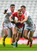 4 June 2022; Brian Hurley of Cork is tackled by Daire Kelly, left, Sam Mulroy of Louth during the GAA Football All-Ireland Senior Championship Round 1 match between Cork and Louth at Páirc Ui Chaoimh in Cork. Photo by Eóin Noonan/Sportsfile