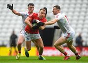 4 June 2022; Brian Hurley of Cork is tackled by Daire Kelly, left, Sam Mulroy of Louth during the GAA Football All-Ireland Senior Championship Round 1 match between Cork and Louth at Páirc Ui Chaoimh in Cork. Photo by Eóin Noonan/Sportsfile