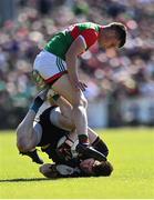 4 June 2022; Monaghan goalkeeper Rory Beggan is tackled by James Carr of Mayo during the GAA Football All-Ireland Senior Championship Round 1 match between Mayo and Monaghan at Hastings Insurance MacHale Park in Castlebar, Mayo. Photo by Piaras Ó Mídheach/Sportsfile