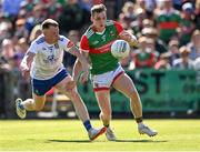 4 June 2022; Eoghan McLaughlin of Mayo in action against Ryan McAnespie of Monaghan during the GAA Football All-Ireland Senior Championship Round 1 match between Mayo and Monaghan at Hastings Insurance MacHale Park in Castlebar, Mayo. Photo by Piaras Ó Mídheach/Sportsfile