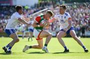 4 June 2022; Jack Carney of Mayo in action against Monaghan players Ryan Wylie, left, and Kieran Duffy during the GAA Football All-Ireland Senior Championship Round 1 match between Mayo and Monaghan at Hastings Insurance MacHale Park in Castlebar, Mayo. Photo by Piaras Ó Mídheach/Sportsfile