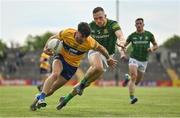 4 June 2022; Aaron Griffin of Clare in action against Conor McGill of Meath during the GAA Football All-Ireland Senior Championship Round 1 match between Clare and Meath at Cusack Park in Ennis, Clare. Photo by Seb Daly/Sportsfile