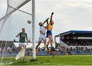4 June 2022; Pearse Lillis of Clare beats Meath goalkeeper Harry Hogan to the ball to score his side's first goal during the GAA Football All-Ireland Senior Championship Round 1 match between Clare and Meath at Cusack Park in Ennis, Clare. Photo by Seb Daly/Sportsfile