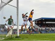 4 June 2022; Pearse Lillis of Clare beats Meath goalkeeper Harry Hogan to the ball to score his side's first goal during the GAA Football All-Ireland Senior Championship Round 1 match between Clare and Meath at Cusack Park in Ennis, Clare. Photo by Seb Daly/Sportsfile