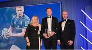 4 June 2022; Ciarán Frawley is presented with the BDO Supporters of the Year award by Ciaran Medlar of BDO and incoming Leinster Rugby President Debbie Carty during the Leinster Rugby Awards Ball at The Clayton Hotel Burlington Road in Dublin. The Leinster Rugby Awards Ball was a celebration of the 2021/22 Leinster Rugby season to date. Photo by Harry Murphy/Sportsfile