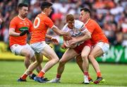5 June 2022; Peter Harte of Tyrone in action against Armagh players, from left, Aidan Forker, Rory Grugan and Stephen Sheridan during the GAA Football All-Ireland Senior Championship Round 1 match between Armagh and Tyrone at Athletic Grounds in Armagh. Photo by Ben McShane/Sportsfile