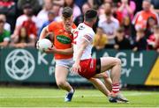 5 June 2022; Aidan Nugent of Armagh gets past the challenge of Peter Teague of Tyrone during the GAA Football All-Ireland Senior Championship Round 1 match between Armagh and Tyrone at Athletic Grounds in Armagh. Photo by Ben McShane/Sportsfile