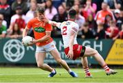 5 June 2022; Aidan Nugent of Armagh gets past the challenge of Peter Teague of Tyrone during the GAA Football All-Ireland Senior Championship Round 1 match between Armagh and Tyrone at Athletic Grounds in Armagh. Photo by Ben McShane/Sportsfile