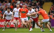 5 June 2022; Michael McKernan of Tyrone is tackled by James Morgan of Armagh during the GAA Football All-Ireland Senior Championship Round 1 match between Armagh and Tyrone at Athletic Grounds in Armagh. Photo by Ramsey Cardy/Sportsfile