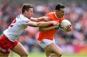 5 June 2022; James Morgan of Armagh is tackled by Niall Sludden of Tyrone during the GAA Football All-Ireland Senior Championship Round 1 match between Armagh and Tyrone at Athletic Grounds in Armagh. Photo by Ben McShane/Sportsfile