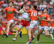 5 June 2022; Matthew Donnelly of Tyrone in action against Ben Crealey, left, and Paddy Burns of Armagh during the GAA Football All-Ireland Senior Championship Round 1 match between Armagh and Tyrone at Athletic Grounds in Armagh. Photo by Ramsey Cardy/Sportsfile