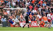 5 June 2022; Conor McKenna of Tyrone, 15, scores his side's first goal past Armagh goalkeeper Ethan Rafferty during the GAA Football All-Ireland Senior Championship Round 1 match between Armagh and Tyrone at Athletic Grounds in Armagh. Photo by Ben McShane/Sportsfile