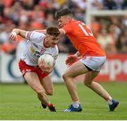 5 June 2022; Conor Meyler of Tyrone is tackled by Aidan Nugent of Armagh during the GAA Football All-Ireland Senior Championship Round 1 match between Armagh and Tyrone at Athletic Grounds in Armagh. Photo by Ramsey Cardy/Sportsfile
