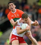 5 June 2022; Niall Sludden of Tyrone is tackled by Rory Grugan of Armagh during the GAA Football All-Ireland Senior Championship Round 1 match between Armagh and Tyrone at Athletic Grounds in Armagh. Photo by Ramsey Cardy/Sportsfile