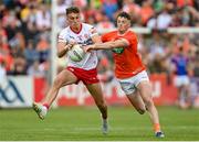 5 June 2022; Conn Kilpatrick of Tyrone in action against Connaire Mackin of Armagh during the GAA Football All-Ireland Senior Championship Round 1 match between Armagh and Tyrone at Athletic Grounds in Armagh. Photo by Ramsey Cardy/Sportsfile