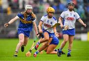 5 June 2022; Niamh Rockett of Waterford is tackled by Niamh Treacy of Tipperary during the Glen Dimplex Senior Camogie Championship match between Tipperary and Waterford at Semple Stadium in Thurles, Tipperary. Photo by Ray McManus/Sportsfile