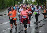 5 June 2022; Participants passing the Vhi motivation station in the 2022 Vhi Women’s Mini Marathon in Dublin. 20,000 women from all over the country took to the streets of Dublin to run, walk and jog the 10km route, raising much needed funds for hundreds of charities around the country. www.vhiwomensminimarathon.ie Photo by Seb Daly/Sportsfile
