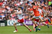 5 June 2022; Matthew Donnelly of Tyrone in action against Rory Grugan of Armagh during the GAA Football All-Ireland Senior Championship Round 1 match between Armagh and Tyrone at Athletic Grounds in Armagh. Photo by Ramsey Cardy/Sportsfile