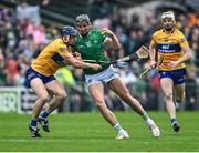 5 June 2022; Gearoid Hegarty of Limerick in action against David McInerney of Clare during the Munster GAA Hurling Senior Championship Final match between Limerick and Clare at FBD Semple Stadium in Thurles, Tipperary. Photo by Piaras Ó Mídheach/Sportsfile