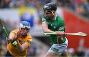 5 June 2022; Gearoid Hegarty of Limerick scores his side's first goal, under pressure from Diarmuid Ryan of Clare, during the Munster GAA Hurling Senior Championship Final match between Limerick and Clare at FBD Semple Stadium in Thurles, Tipperary. Photo by Piaras Ó Mídheach/Sportsfile