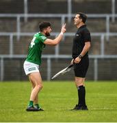 5 June 2022; Ryan Jones of Fermanagh having words with linesman Sean Hurson during the Tailteann Cup Quarter-Final match between Fermanagh and Cavan at Brewster Park in Enniskillen, Fermanagh. Photo by Philip Fitzpatrick/Sportsfile Photo by Philip Fitzpatrick/Sportsfile