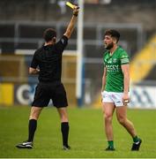 5 June 2022; Referee Paul Faloon hands out a yellow card to Ryan Jones of Fermanagh during the Tailteann Cup Quarter-Final match between Fermanagh and Cavan at Brewster Park in Enniskillen, Fermanagh. Photo by Philip Fitzpatrick/Sportsfile Photo by Philip Fitzpatrick/Sportsfile