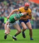5 June 2022; William O'Donoghue of Limerick in action against Peter Duggan of Clare during the Munster GAA Hurling Senior Championship Final match between Limerick and Clare at FBD Semple Stadium in Thurles, Tipperary. Photo by Piaras Ó Mídheach/Sportsfile
