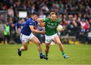 5 June 2022; Ultan Kelm of Fermanagh in action against James Smith of Cavan during the Tailteann Cup Quarter-Final match between Fermanagh and Cavan at Brewster Park in Enniskillen, Fermanagh. Photo by Philip Fitzpatrick/Sportsfile