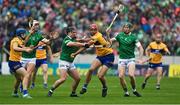 5 June 2022; Peter Duggan of Clare is tackled by Darragh O'Donovan of Limerick during the Munster GAA Hurling Senior Championship Final match between Limerick and Clare at FBD Semple Stadium in Thurles, Tipperary. Photo by Brendan Moran/Sportsfile