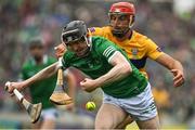 5 June 2022; Declan Hannon of Limerick is tackled by Peter Duggan of Clare during the Munster GAA Hurling Senior Championship Final match between Limerick and Clare at FBD Semple Stadium in Thurles, Tipperary. Photo by Brendan Moran/Sportsfile