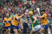 5 June 2022; Tom Morrissey of Limerick in action against Clare players David McInerney left, and Cathal Malone during the Munster GAA Hurling Senior Championship Final match between Limerick and Clare at FBD Semple Stadium in Thurles, Tipperary. Photo by Piaras Ó Mídheach/Sportsfile