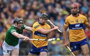 5 June 2022; Declan Hannon of Limerick knocks the ball away from Ian Galvin of Clare as he prepares to take a shot on goal during the Munster GAA Hurling Senior Championship Final match between Limerick and Clare at FBD Semple Stadium in Thurles, Tipperary. Photo by Piaras Ó Mídheach/Sportsfile