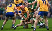 5 June 2022; Peter Duggan of Clare, supported by teammate Ian Galvin, left, in action against Seán Finn of Limerick during the Munster GAA Hurling Senior Championship Final match between Limerick and Clare at FBD Semple Stadium in Thurles, Tipperary. Photo by Piaras Ó Mídheach/Sportsfile