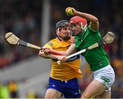 5 June 2022; Barry Nash of Limerick is tackled by Ryan Taylor of Clare during the Munster GAA Hurling Senior Championship Final match between Limerick and Clare at Semple Stadium in Thurles, Tipperary. Photo by Ray McManus/Sportsfile