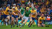 5 June 2022; Séamus Flanagan of Limerick is tackled by Rory Hayes and Conor Cleary of Clare during the Munster GAA Hurling Senior Championship Final match between Limerick and Clare at FBD Semple Stadium in Thurles, Tipperary. Photo by Brendan Moran/Sportsfile