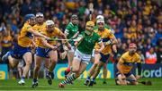 5 June 2022; Séamus Flanagan of Limerick races clear of Rory Hayes and Conor Cleary of Clare during the Munster GAA Hurling Senior Championship Final match between Limerick and Clare at FBD Semple Stadium in Thurles, Tipperary. Photo by Brendan Moran/Sportsfile