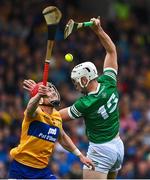 5 June 2022; Kyle Hayes of Limerick contests a looke ball with Paul Flanagan of Clare during the Munster GAA Hurling Senior Championship Final match between Limerick and Clare at FBD Semple Stadium in Thurles, Tipperary. Photo by Brendan Moran/Sportsfile