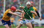 5 June 2022; Kyle Hayes of Limerick is tackled by Paul Flanagan of Clare during the Munster GAA Hurling Senior Championship Final match between Limerick and Clare at FBD Semple Stadium in Thurles, Tipperary. Photo by Brendan Moran/Sportsfile
