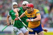 5 June 2022; Paul Flanagan of Clare is tackled by Aaron Gillane of Limerick during the Munster GAA Hurling Senior Championship Final match between Limerick and Clare at FBD Semple Stadium in Thurles, Tipperary. Photo by Brendan Moran/Sportsfile
