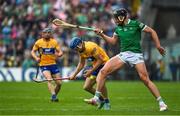 5 June 2022; Shane O'Donnell of Clare attempts to gather possession ahead of Gearoid Hegarty of Limerick during the Munster GAA Hurling Senior Championship Final match between Limerick and Clare at FBD Semple Stadium in Thurles, Tipperary. Photo by Brendan Moran/Sportsfile