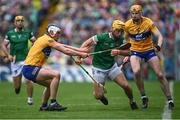 5 June 2022; Tom Morrisey of Limerick in action against Clare players Diarmuid Ryan, left, and David Fitzgerald of Clare during the Munster GAA Hurling Senior Championship Final match between Limerick and Clare at FBD Semple Stadium in Thurles, Tipperary. Photo by Piaras Ó Mídheach/Sportsfile